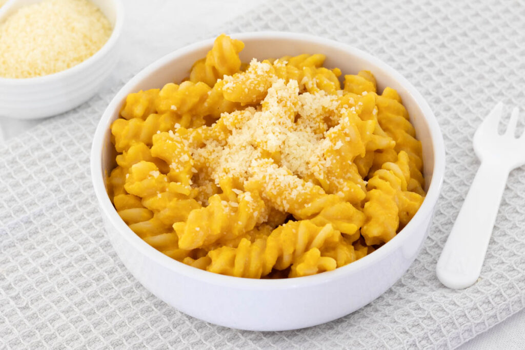 Butternut Squash Pasta in a small white bowl served for a toddler.