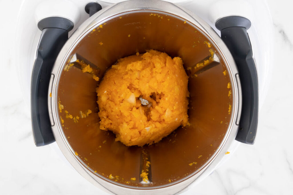 Step 3 of Butternut Squash Pasta process in a Thermomix, sautéing the vegetables.