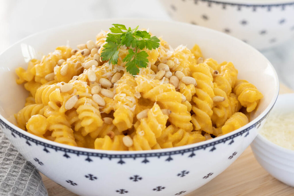 Butternut Squash Pasta garnished with parmesan and toasted pine nuts for older family.