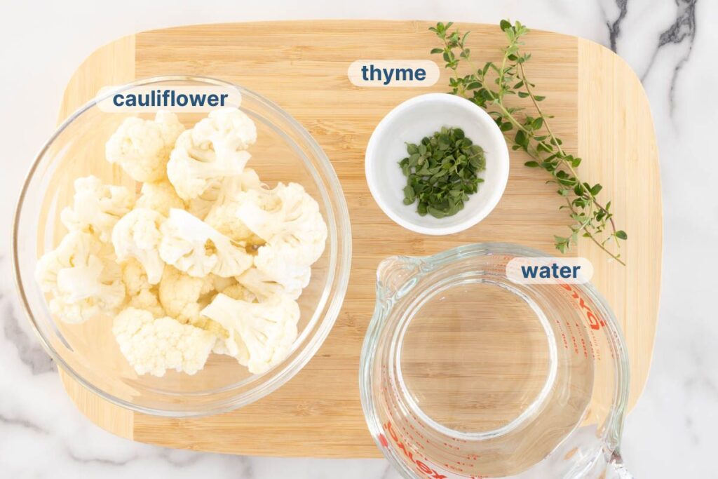 Cauliflower puree labelled ingredients on a chopping board.