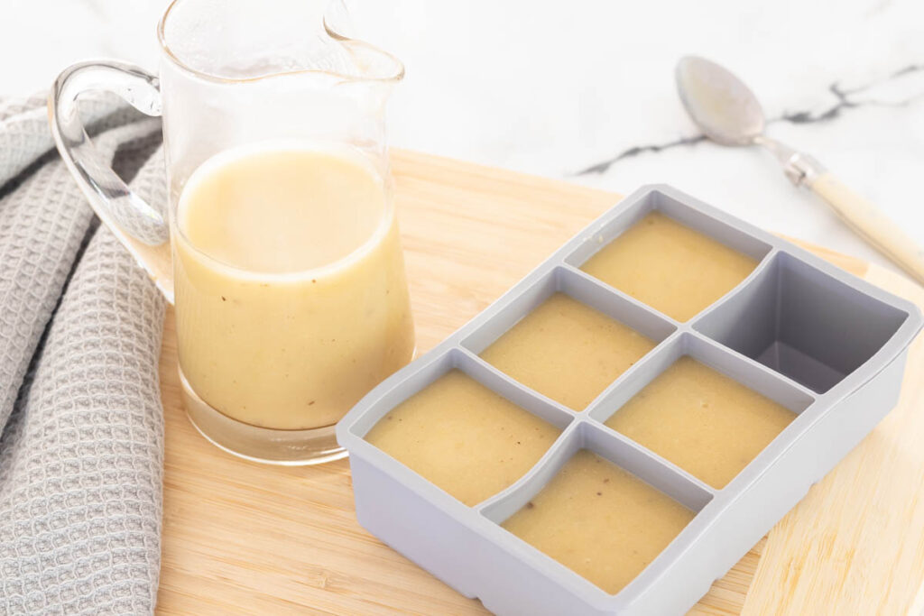 Low Sodium Gravy poured into a large ice cube tray for freezing.