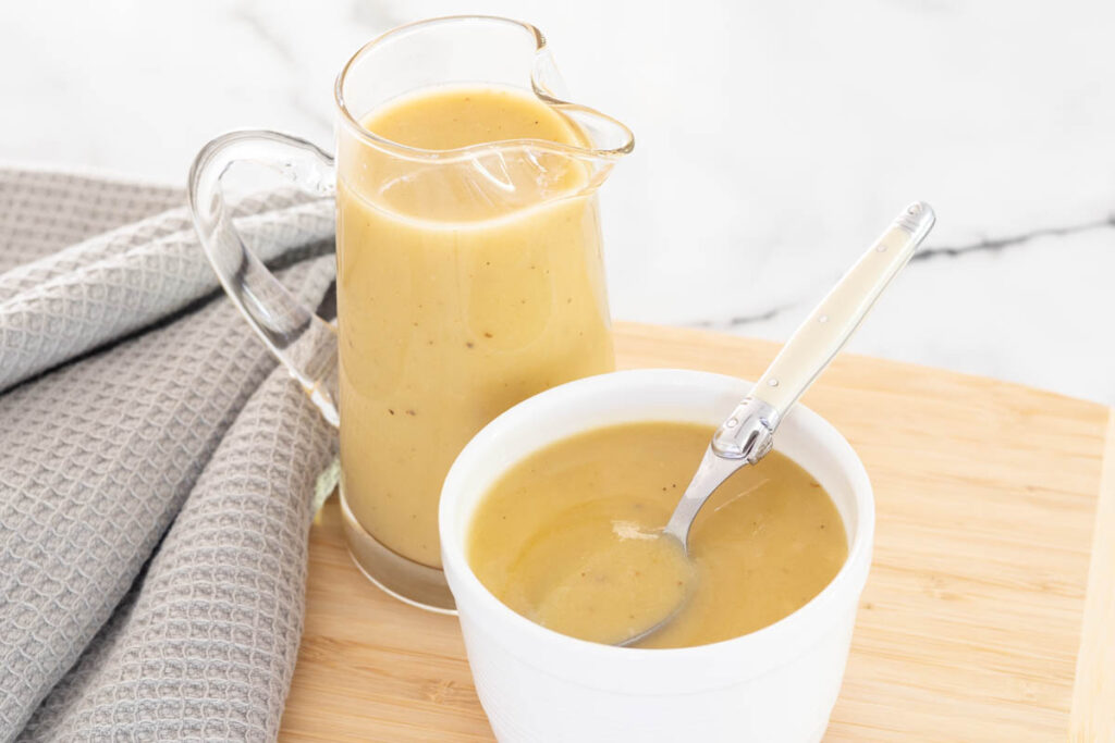 Salt free gravy served in a gravy jug and ramekin with spoon.