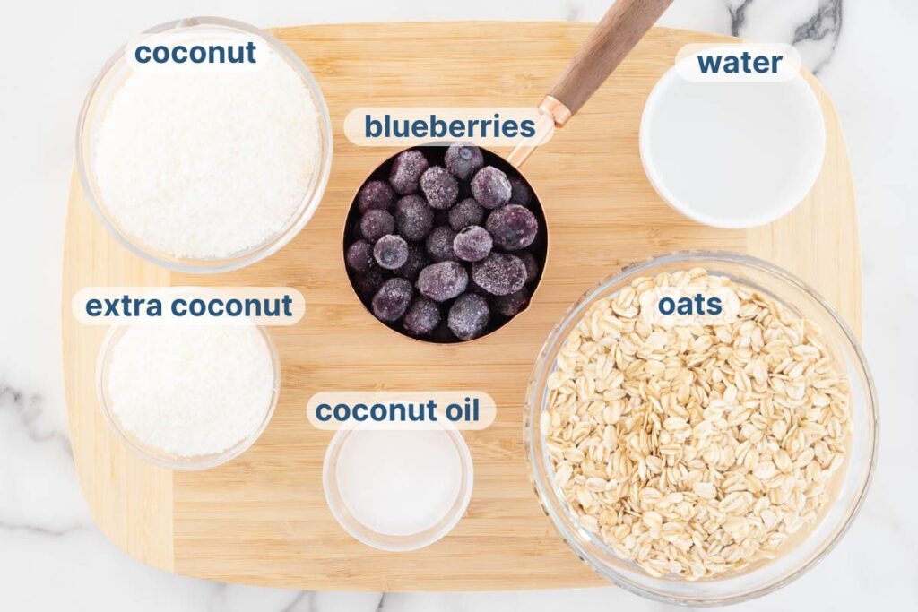 Blueberry Bliss Balls labelled ingredients on a chopping board.